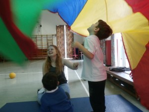Playing with the parachute during PE.