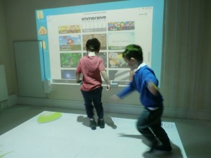 Balloon popping on the interactive floor in the light and sound room.